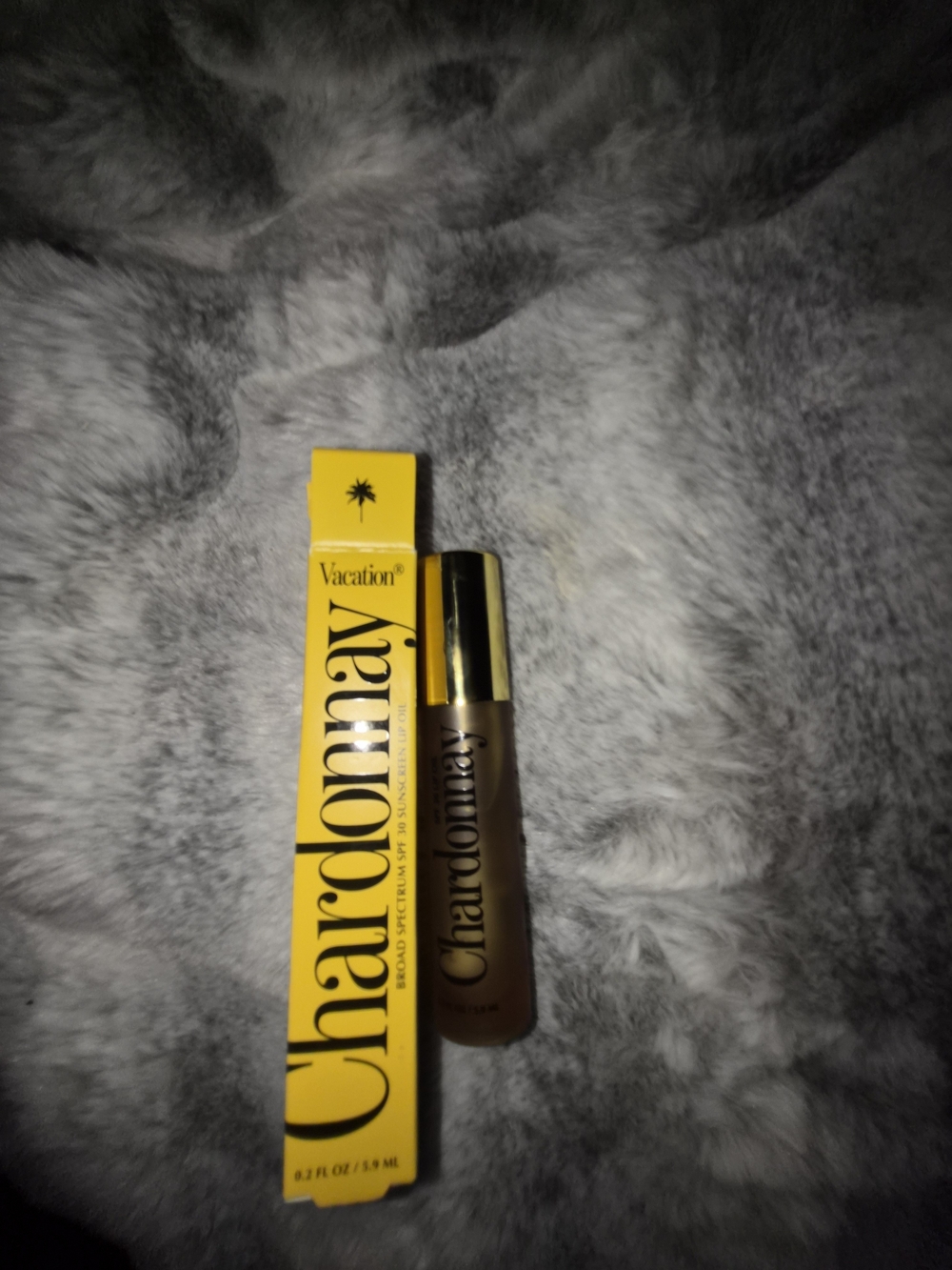 Vacation Chardonnay Broad Spectrum SPF 30 Sunscreen Lip Oil. Full size 0.2 fl oz